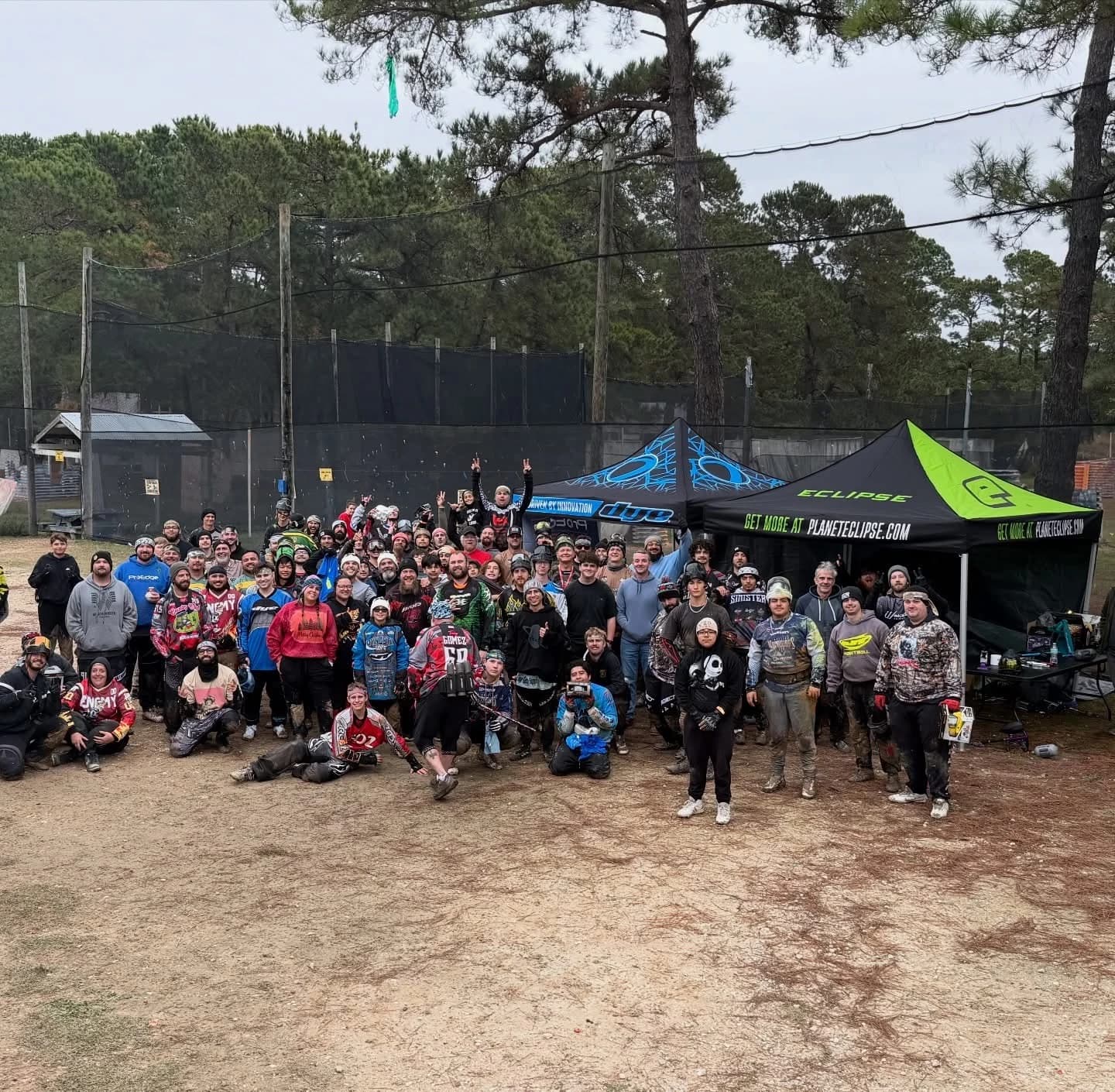 A large group of paintball players gathered outdoors at TXR Paintball in Cypress, near Houston.